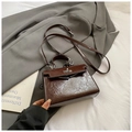 Sac Kelly vintage marron foncé en cuir brillant avec texture huilée et fermoir argenté - Café sans Pendentif