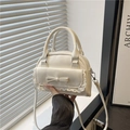 Cream chic bowling bag with lace bow detail, stylish shoulder and crossbody style - White
