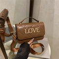 Brown quilted leather handbag with gold LOVE letters and stylish woven wide strap - Brown
