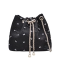 Chic black bucket bag with white bow pattern, metal chain and elegant pearl pendant - Black