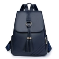 Dark blue pebbled leather backpack with tassel charms and golden ring front flap design - Blue