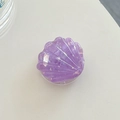 Macro shot of purple resin shell phone grip showing glitter texture and foldable stand - Purple