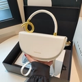 White faux leather saddle bag with distinctive gold knot handle and shoulder strap - White