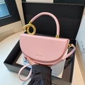 Pink saddle handbag with gold knot hardware in a luxury gift box packaging - Pink