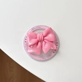 Macro detail of pink bow magnetic phone socket with Gift For You decorative base - Rose Red