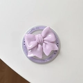 Close-up of lilac bow magnetic phone socket with Gift For You text on clear base - Purple