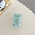 Close-up of light blue resin bear phone grip with decorative gold foil flakes inside - Light Blue (Gold Foil Transparent Bear)
