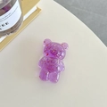 Close-up of a purple resin bear phone grip with sparkling gold and red foil fragments - Light Purple (Gold Foil Transparent Bear)
