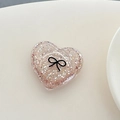 Detail of pink glitter heart phone socket with a minimalist black bow pattern - 3D Heart Polka Dot Glitter Black Bow / Brown