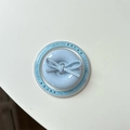 Close-up of light blue magnetic button phone socket with bow and Gift For You text - Magnetic Bow Button / Blue