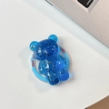 Détail d'un support de téléphone ours bleu translucide avec flocons d'or et texte Good Luck - Bleu Royal