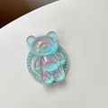 Dettaglio del supporto per telefono a forma di orso olografico con riflessi arcobaleno lucidi - Verde