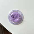Macro shot of purple button bow phone grip with Gift For You decorative text design - Magnetic Bow Button / Purple