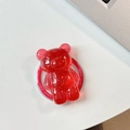 Détail du support téléphone ours rouge avec paillettes dorées et texte Good Luck - Rouge Ancorra