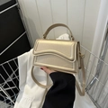 Elegant champagne gold mini square handbag with wavy stitching and adjustable strap - Gold