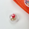 Détail du support de téléphone transparent avec une pomme miniature et des couverts dorés - Support Transparent-Balle-Pomme Croquée+Couteau Fourchette