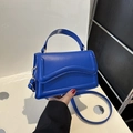 Royal blue wave flap crossbody bag in textured PU leather with adjustable strap - Dark Blue