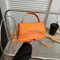 Orange crossbody handbag with U-shaped texture and gold-tone hardware for women - Orange