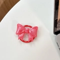 Close-up of pink glitter bow Griptok phone stand with sparkling pearl finish effect - Magnetic Large Bow - Pearlescent / Deep Rose Red