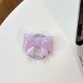 Detail of purple glitter bow phone grip with star pattern and Gift For You text decoration - Magnetic Large Bow - Pearlescent / Purple