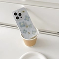 Macro detail of clear iPhone case with blue dried flowers and silver leaf flakes - Lace Blue Hydrangea (iPhone 7/8/SE 2020)