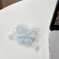 Detail of light blue embroidered butterfly phone socket with elegant pearl chain accents - Embroidered / Blue