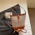 Retro beige woven bucket bag with brown leather trim and metallic CD buckle - Brown
