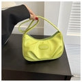 Detail view of neon green pleated PU leather crossbody bag with fashion label - Green