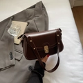 Retro dark brown crossbody bag with gold twist lock and metal rivet strap accents - Coffee