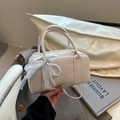 Creamy beige Boston handbag with pearl bow charm and KS&KS embossed lettering - White with Pendant