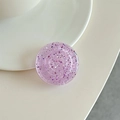 Detail of a purple round phone grip featuring glitter sequins and a translucent design - Transparent Purple