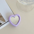 Close-up of a purple heart-shaped collapsible phone socket with integrated mirror - Purple