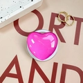 Macro shot of glossy fluorescent pink heart-shaped phone grip with a smooth resin finish - Rose Red