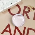 Close-up of a pink heart-shaped phone grip with a translucent jelly-like finish - Light Pink