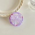 Macro shot of purple holographic laser bow phone grip with Good Luck text details - Purple