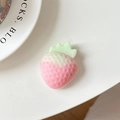 Macro detail of 3D pink strawberry phone grip with realistic seeds and green leaves - Pink (Pink Jade)