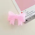 Detail of pink bow phone socket made of glitter resin with a translucent base - Large Bowknot Stand - Pearlized - Pink