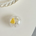 Macro shot of phone grip featuring miniature cheese, silver cutlery and metallic beads - Transparent Griptok-Cheese