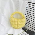 Mini quilted cloud bag in bright yellow finish with puff texture and top handle - Yellow