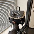 Mini black backpack for women featuring lace trim and a cream bow on the front - Black