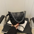Minimalist black bucket bag with lychee texture, bear print, and silver chain strap - Black