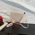 White faux leather crossbody bag with rhinestone-encrusted triangular flap detail - Gold