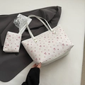White leather tote bag with pink bow floral print and matching small clutch handbag - White