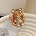 Dettaglio del supporto per telefono orso ambra traslucido con base incisa Good Luck - Orso Increspatura dell'Acqua (Magnetico) / Arancione