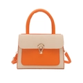 Two-tone crossbody bag with orange leather and beige canvas featuring a gold teardrop lock - Orange