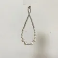 Macro shot of faux pearl lanyard with rhinestone spacers and silver metal ring connector - Multi-Pearl Rhinestone Chain + Transparent Patch