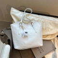 White faux leather tote bag with embossed patterns and a white monster plush charm - With Charm / White