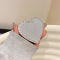 Detail of silver heart phone socket grip with sparkling rhinestones and crystal border - Silver