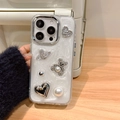 Detail of iPhone case featuring pearl rhinestone bear, heart gems and glittery white finish - White Shimmer Drip Glue Planet Pearl Bear / iPhone 7/8/SE 2020