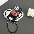 Detail of iPhone case with 3D plush bear head and leather strap on metal tray - Black / iPhone 7/8/SE 2020